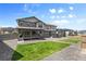Well-maintained backyard with small lawn areas and low maintenance gravel landscaping at 138 Lullaby Ln, Castle Rock, CO 80109