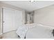 Bedroom with sliding-door closet and neutral carpet. View into ensuite bathroom at 138 Lullaby Ln, Castle Rock, CO 80109