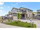 Beautiful home exterior with a well-maintained yard, charming porch, and neutral paint colors at 138 Lullaby Ln, Castle Rock, CO 80109