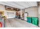 Organized garage with storage racks, workbench, and plenty of space for vehicles at 138 Lullaby Ln, Castle Rock, CO 80109