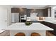 Modern kitchen featuring stainless appliances, dark cabinets and a white quartz island, ideal for entertaining at 138 Lullaby Ln, Castle Rock, CO 80109