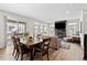 Spacious dining and living area boasts hardwood floors, a fireplace, and plenty of natural light at 138 Lullaby Ln, Castle Rock, CO 80109