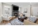 Bright living room featuring a modern fireplace and comfortable seating, perfect for relaxing and entertaining guests at 138 Lullaby Ln, Castle Rock, CO 80109