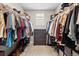 Spacious walk-in closet with ample hanging space, shelving, and a central dresser at 138 Lullaby Ln, Castle Rock, CO 80109