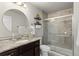 Bathroom with a large walk-in shower, granite countertop and updated fixtures at 6108 Summit Peak Ct # 102, Erie, CO 80516