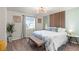 Spacious bedroom with king-size bed and en-suite bathroom at 6108 Summit Peak Ct # 102, Erie, CO 80516