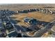 Community park with playground, basketball court, and community building at 6108 Summit Peak Ct # 102, Erie, CO 80516