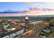 Scenic aerial view shows community with modern apartments, single Gathering homes, and historic water tower at 5402 Carr St # 307, Arvada, CO 80002