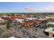 Aerial view of city with a variety of brick buildings, streets, and parking at 5402 Carr St # 307, Arvada, CO 80002