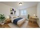 Cozy bedroom with a comfortable bed, modern desk, and bright window for ample natural light at 5402 Carr St # 307, Arvada, CO 80002