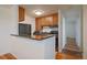 Well-appointed kitchen with sleek black appliances, ample cabinet space, and a breakfast bar at 5402 Carr St # 307, Arvada, CO 80002