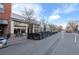 A pedestrian friendly street featuring sidewalk cafes and boutiques, creating a lively community atmosphere at 5402 Carr St # 307, Arvada, CO 80002