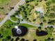 Gorgeous aerial view of a landscaped home and lot, complete with ponds and mature trees at 7197 Timbers Dr, Evergreen, CO 80439