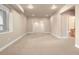 Spacious basement area with neutral carpet, recessed lighting, and an open floor plan at 7197 Timbers Dr, Evergreen, CO 80439