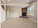 Bright and airy basement with stone fireplace and great natural light at 7197 Timbers Dr, Evergreen, CO 80439