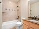 Bathroom with tile surround shower and granite countertop at 7197 Timbers Dr, Evergreen, CO 80439