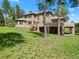 Large home with backyard and shaded patio at 7197 Timbers Dr, Evergreen, CO 80439