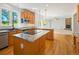 Well-equipped kitchen with stainless steel appliances, granite countertops, and a breakfast bar at 7197 Timbers Dr, Evergreen, CO 80439