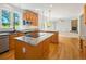 Kitchen with stainless steel appliances, granite countertop, hardwood floors and attached dining area at 7197 Timbers Dr, Evergreen, CO 80439