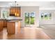 Bright kitchen with granite counters, stainless steel appliances, and a view of the backyard at 7197 Timbers Dr, Evergreen, CO 80439