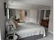 Open bedroom features a neutral color palette, carpeted floor, and ensuite bathroom at 15156 W Baker Pl, Lakewood, CO 80228