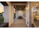 Spacious covered patio with seating, featuring views of the landscape and seamless indoor-outdoor living at 15156 W Baker Pl, Lakewood, CO 80228