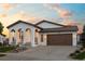Beautiful single-Gathering home with a charming front porch and attached two-car garage, perfect for suburban living at 15156 W Baker Pl, Lakewood, CO 80228