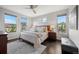 Serene main bedroom with ample natural light, wood floors, and a neutral color palette for a calm retreat at 15156 W Baker Pl, Lakewood, CO 80228