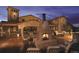 Gorgeous outdoor stone patio with inviting fireplace and seating at 15156 W Baker Pl, Lakewood, CO 80228