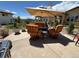 Inviting backyard patio with ample seating and shade, perfect for outdoor entertaining and relaxing at 15156 W Baker Pl, Lakewood, CO 80228