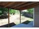An outside view under the deck showing the fenced backyard and natural light at 2517 S Genoa St, Aurora, CO 80013