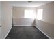 Finished basement with carpet and white trim, offering ample space and natural light at 2517 S Genoa St, Aurora, CO 80013