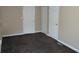 A finished basement with carpet and white trim, offering ample space at 2517 S Genoa St, Aurora, CO 80013