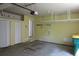 Spacious garage interior with ample storage, shelving and a door to the house at 2517 S Genoa St, Aurora, CO 80013