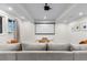 Basement media room featuring a large sectional couch and projection screen at 3636 Sublime Ct, Castle Rock, CO 80108