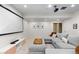 Basement media room features a large sectional couch and projection screen at 3636 Sublime Ct, Castle Rock, CO 80108
