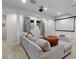 Basement media room featuring a large sectional couch and projection screen at 3636 Sublime Ct, Castle Rock, CO 80108