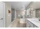 Bright bathroom featuring a soaking tub, double vanity, and walk-in glass shower at 3636 Sublime Ct, Castle Rock, CO 80108