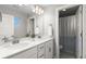 Bright bathroom featuring a double vanity with modern fixtures and a shower at 3636 Sublime Ct, Castle Rock, CO 80108