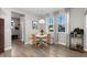 Charming dining area featuring bench seating, woven chairs, and natural light at 3636 Sublime Ct, Castle Rock, CO 80108