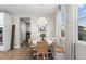 Charming dining area with bench seating, woven chairs, and ample natural light at 3636 Sublime Ct, Castle Rock, CO 80108