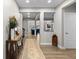 Open concept entryway with hardwood floors and views into the living and dining spaces at 3636 Sublime Ct, Castle Rock, CO 80108