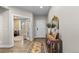 Bright entryway with hardwood floors, decorative rug, and an elegant console table at 3636 Sublime Ct, Castle Rock, CO 80108