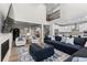 Bright and airy living room with a large sectional sofa and vaulted ceilings at 3636 Sublime Ct, Castle Rock, CO 80108