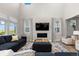 Spacious living room with high ceilings, a modern fireplace, and comfortable seating at 3636 Sublime Ct, Castle Rock, CO 80108