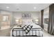 Comfortable primary bedroom with a soft color palette, large windows, and bedside tables at 3636 Sublime Ct, Castle Rock, CO 80108
