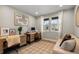 Bright home office with two desks, large windows, and comfortable seating area at 3636 Sublime Ct, Castle Rock, CO 80108
