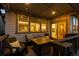 Outdoor patio featuring comfortable seating and a built in firepit table with string lights overhead at 3636 Sublime Ct, Castle Rock, CO 80108
