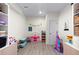 Bright playroom with toys, bookshelves, and wood-look floors, creating a fun and inviting space at 3636 Sublime Ct, Castle Rock, CO 80108