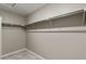 Walk-in closet features carpeted floors and shelf and rod system at 27746 E Byers Pl, Aurora, CO 80018